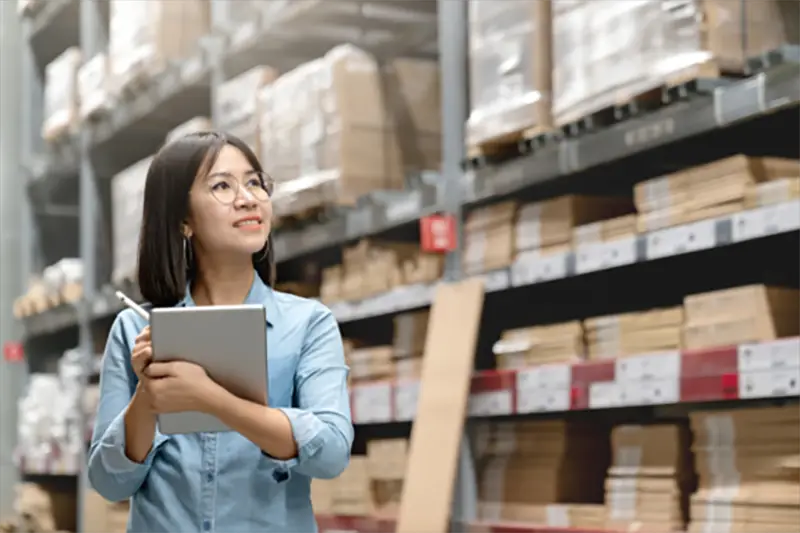 Woman checking inside warehouse