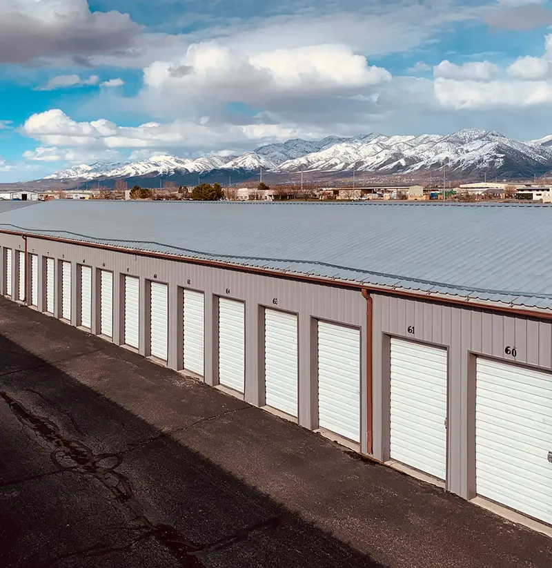 Snowy mountains & self storage in Logan, Utah. TK Secure Storage of Logan & Brigham City surrounded by mountains and panoramic views.