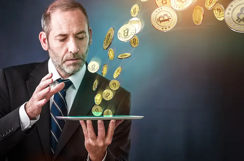 Businessman holding tablet and bitcoin concept