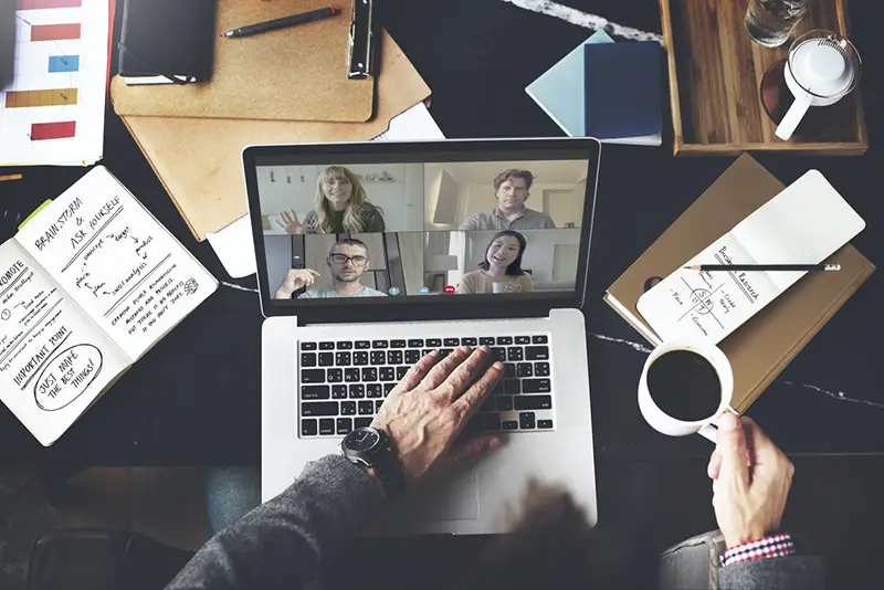 employee in a video conference call while working from home during the coronavirus pandemic