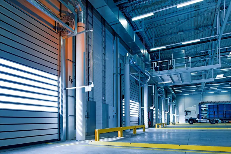 parked truck inside an empty warehouse distribution building