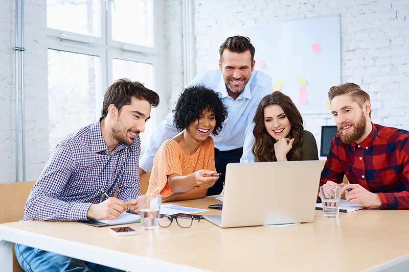 Office colleagues working in a laptop