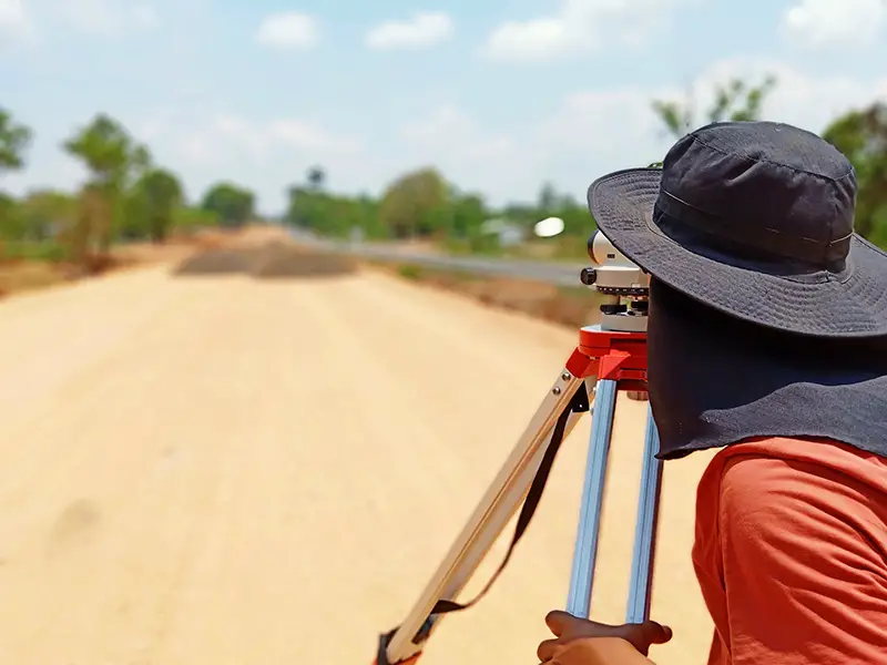 Person measuring the road for concrete construction