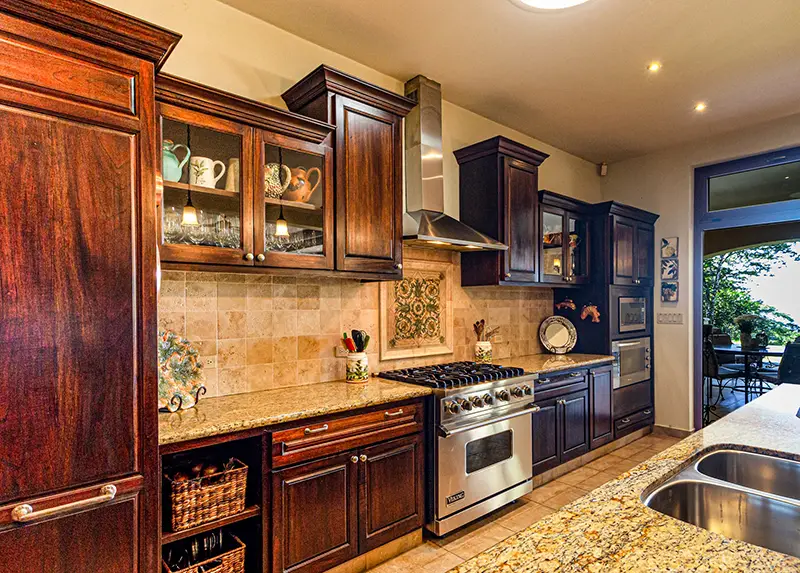 Clean kitchen with dark brown wooden cabinet