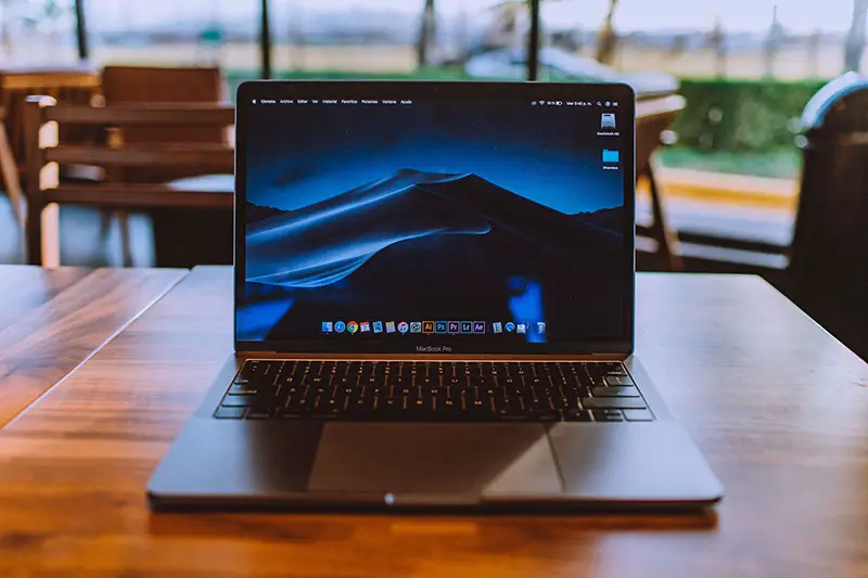 Turned on black laptop computer on the table