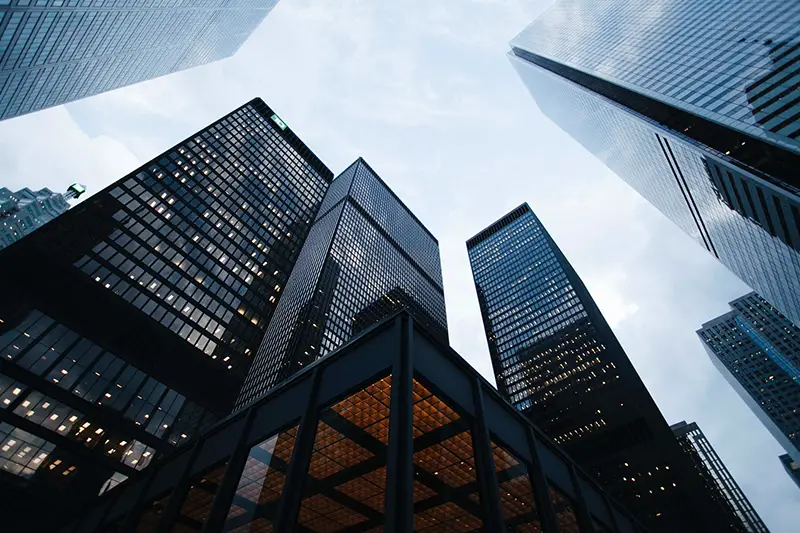 Low angle photo of city high rise buildings