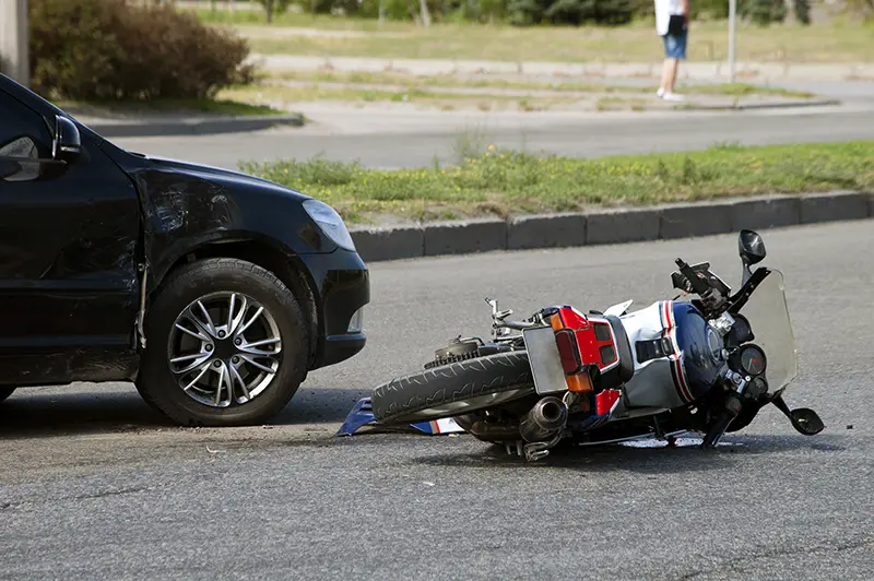 motorcycle and car involved in a collision