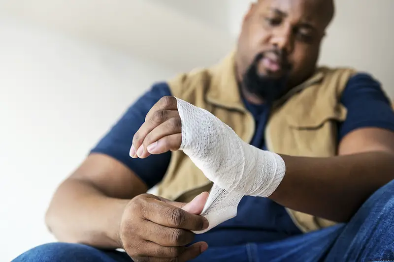 A person involved in work-related accident – bandaged hand and wrist