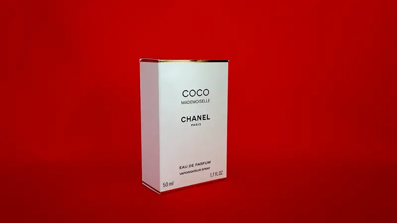 Perfume in a white packaging box