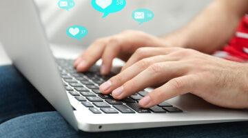 Person using laptop on his lap