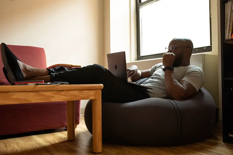 Man using laptop sitting in the couch