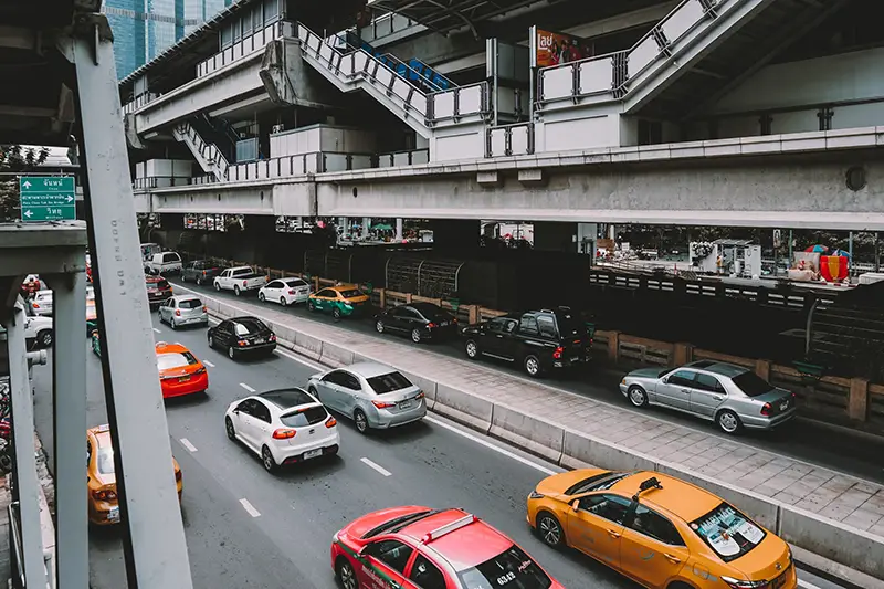 Cars on the road in daytime in Thailand