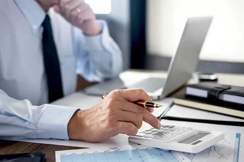 Businessman doing finances calculation