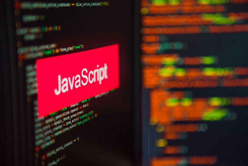 JavaScript Programming language, JavaScript inscription on the background of computer code. Modern digital technologies and programming training