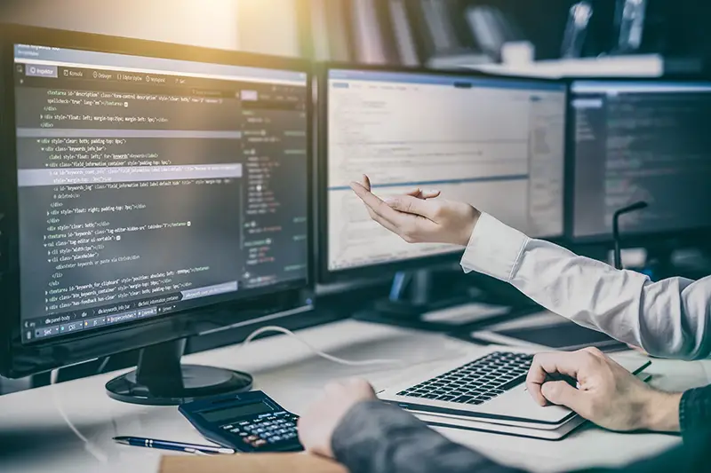 Web developer working in front of his computer