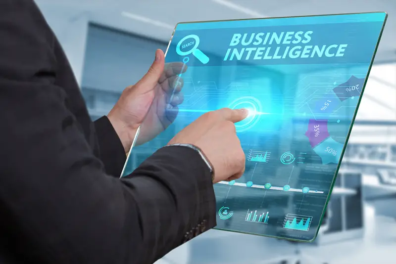 Business, Technology, Internet and network concept. Business man working on the tablet of the future, select on the virtual display: Business intelligence