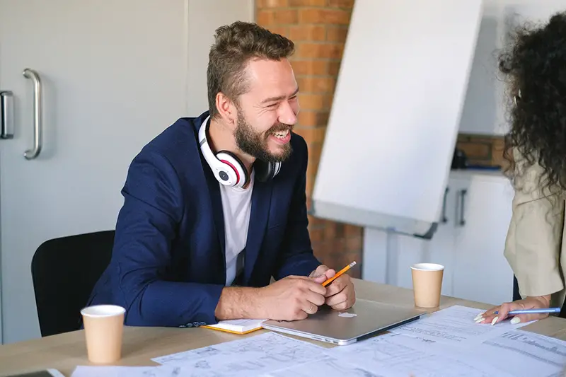 cheerful man in office