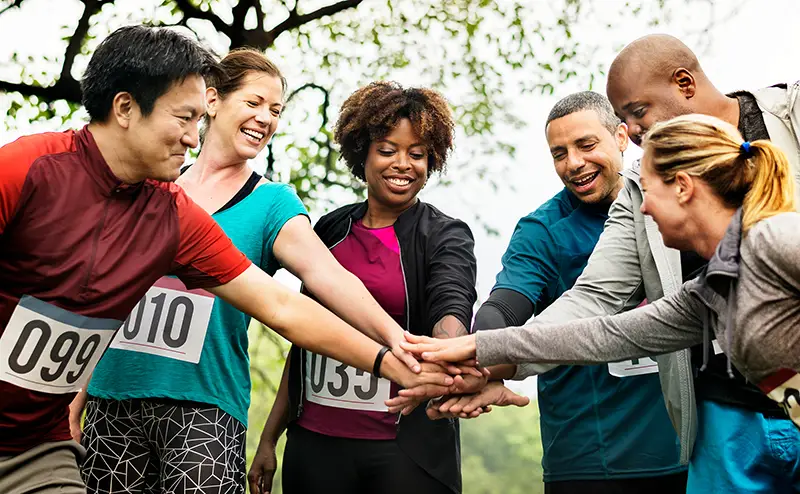 Team of diverse people ready for a race