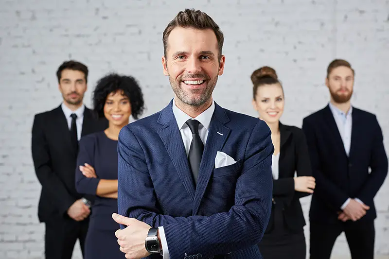 Group of business people with leader at front