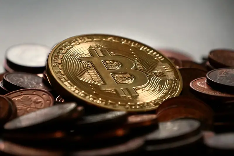 Gold bitcoin together with bronze coins