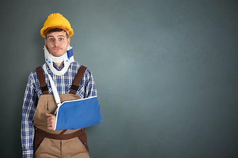 Injured man wearing hard hat