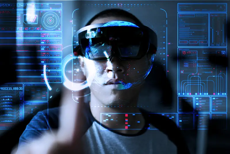 Young men trying Virtual Reality or augmented reality with HoloLens headset - technology