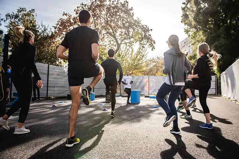 Group of people having morning warm up