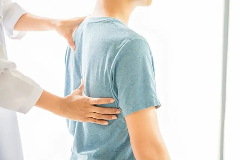 Close up of physiotherapist working with patient in clinic