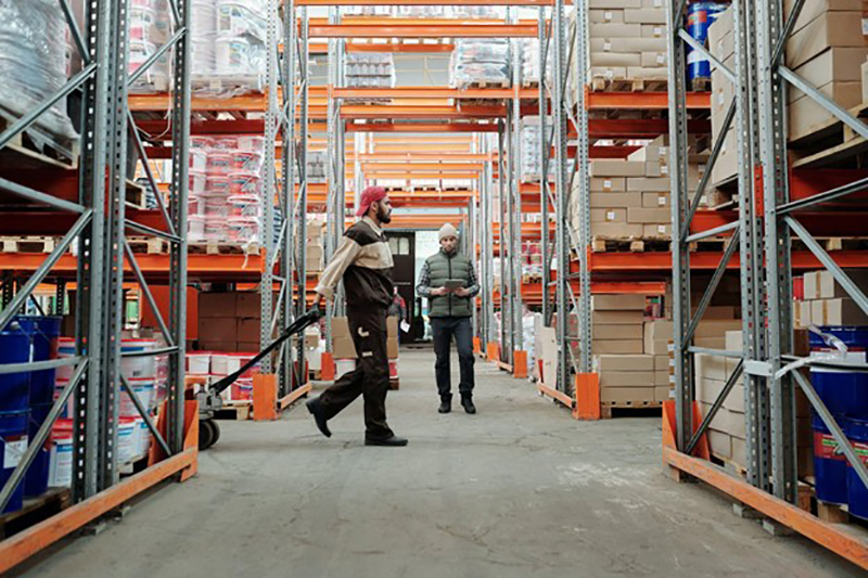 Two people working in a warehouse