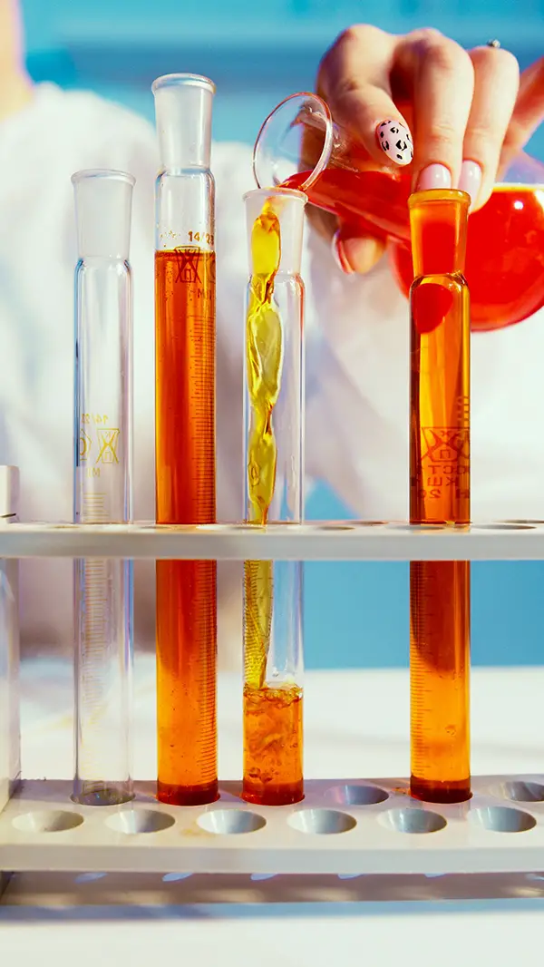 Person pouring mixture in a tube