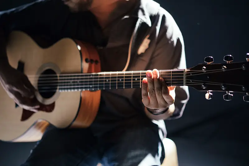 Person playing guitar