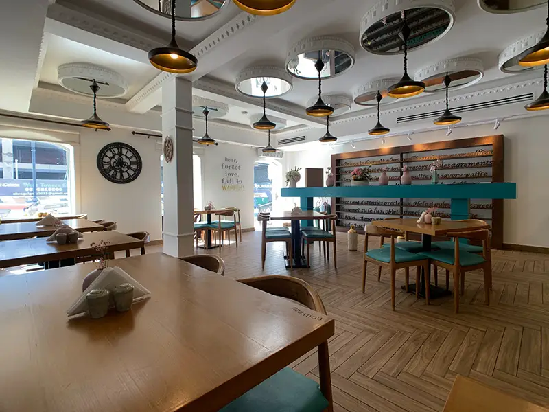 Restaurant with brown wooden table and floor