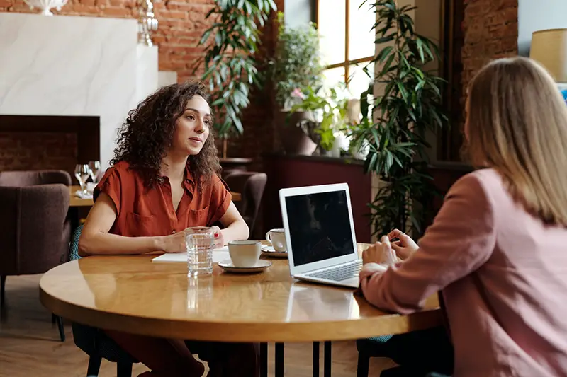 Two women on one on one interview