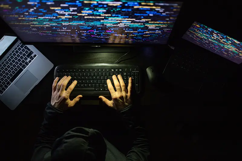 hacker coding at night cybersecurity concept