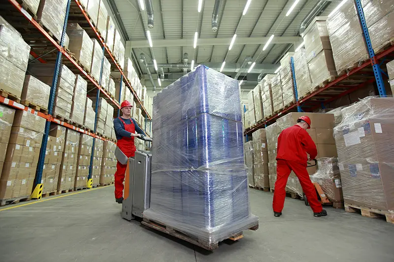 Two man working inside the warehouse