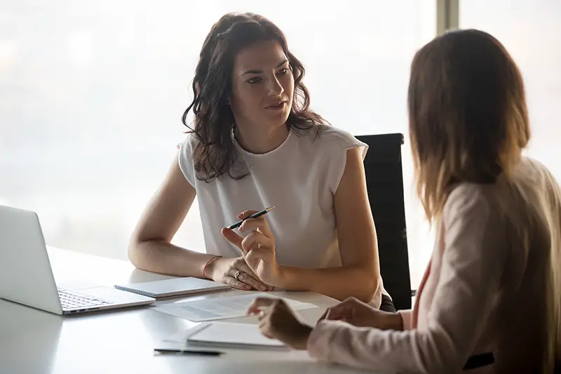 Two businesswoman having conversation