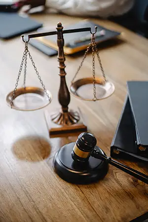 Judge desk with gavel and scales