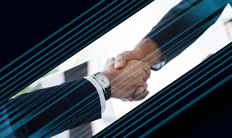 Two business partners shaking hands