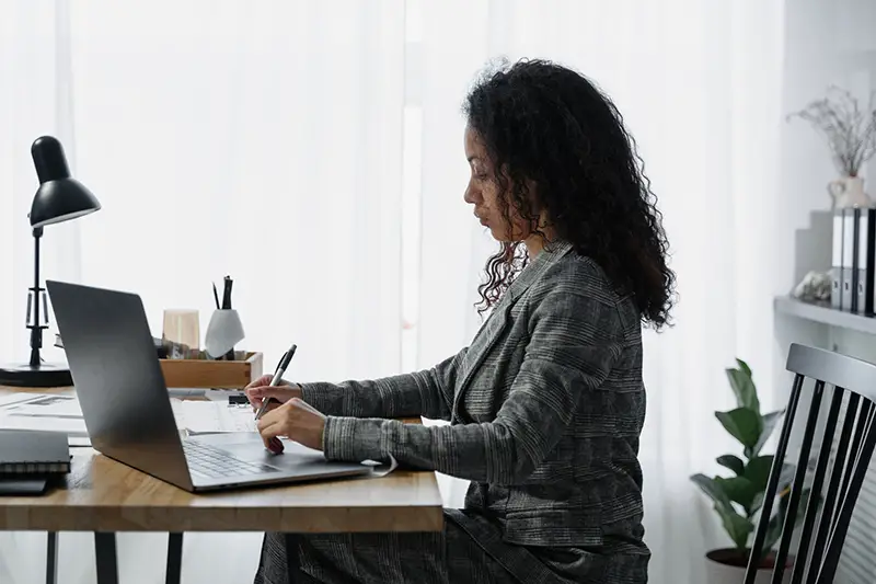 Woman accountant working on her laptop