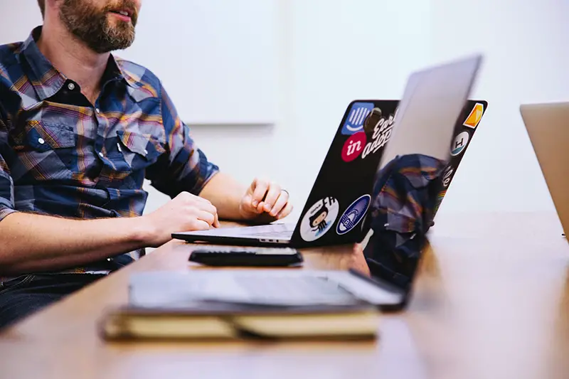 Man sitting in front of laptop