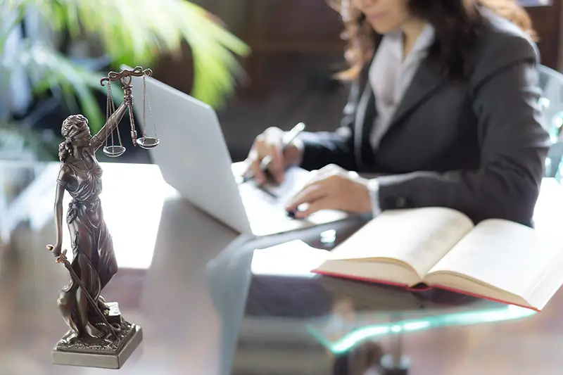 Woman lawyer working on her laptop