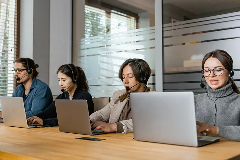 Group of people taking calls