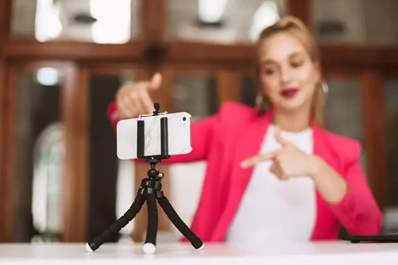 Woman making a video of herself