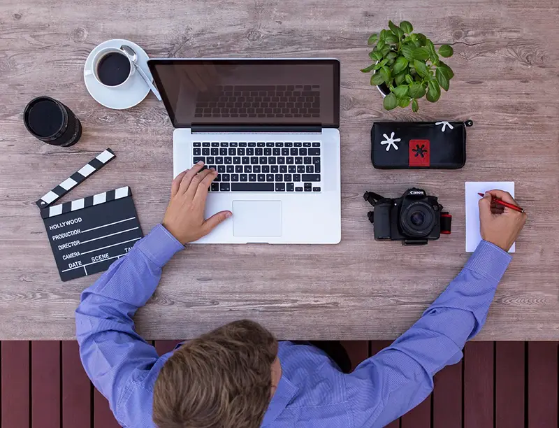 Filmmaker working on his laptop