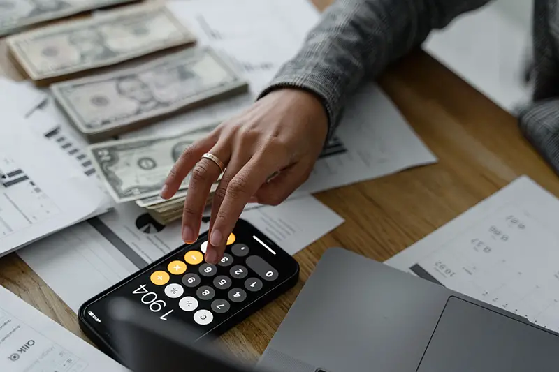 Accountant using the black calculator