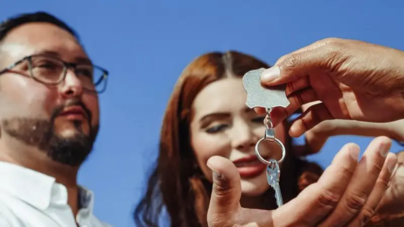 Happy couple taking the house key