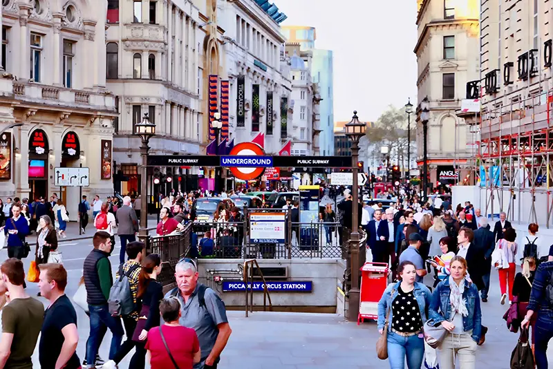 People walking near Picadilly Circus station in London