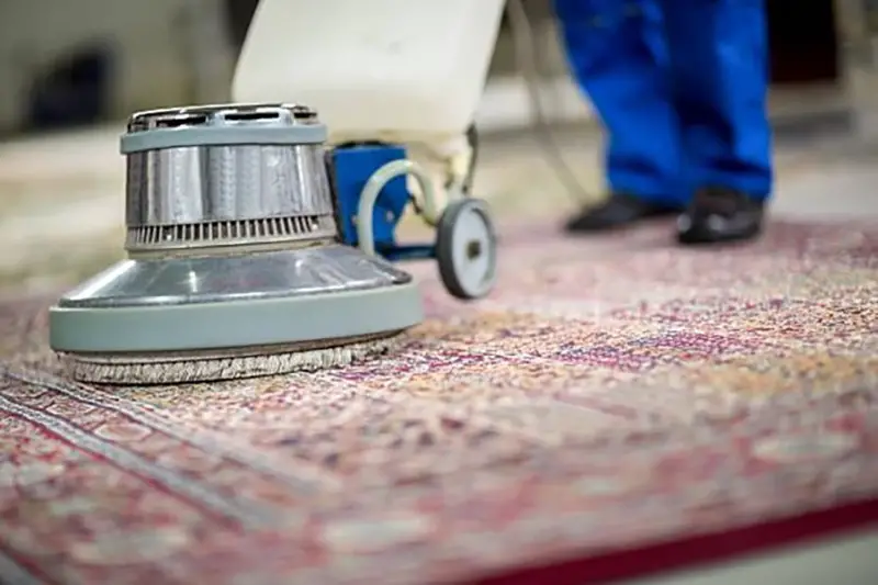 Person cleaning the red carpet