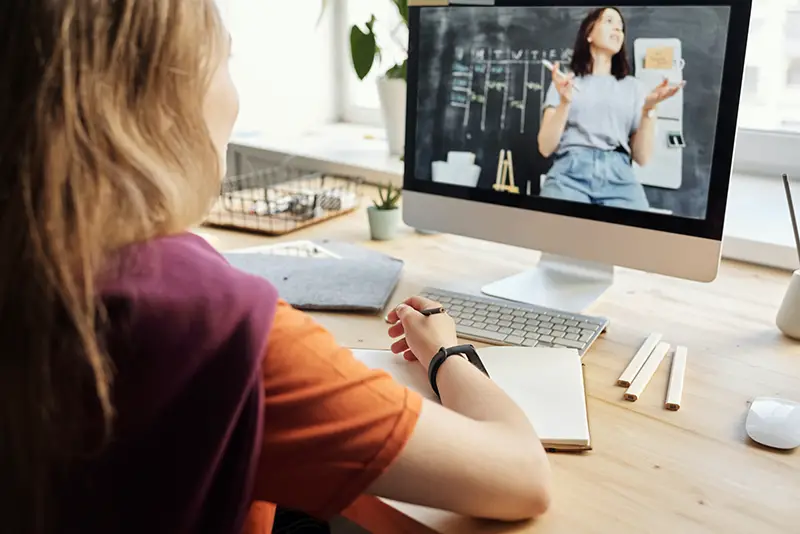 Young woman attending her online class