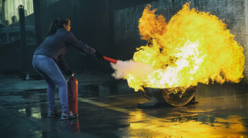 Woman holding fire extinguisher